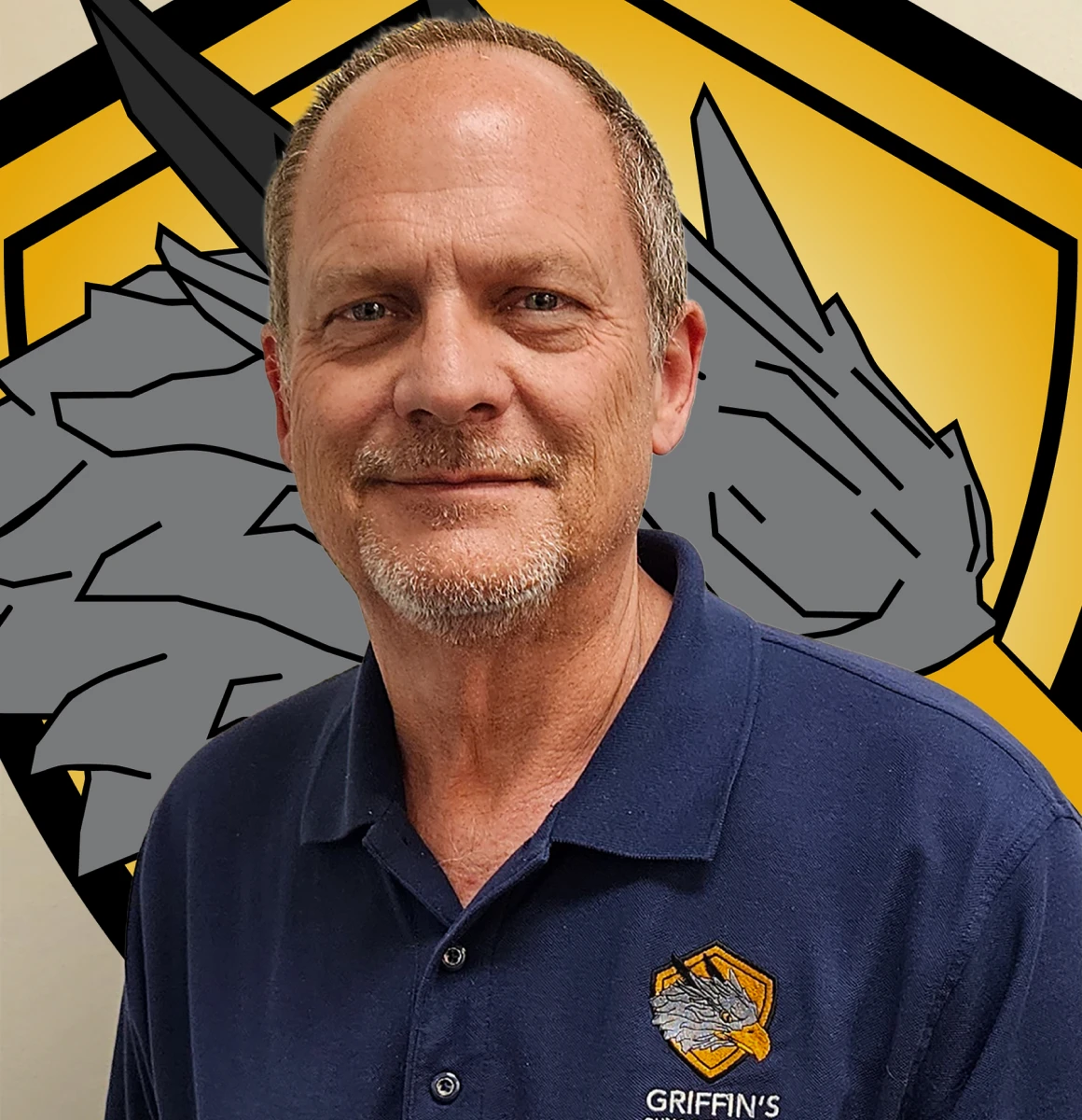 Man in blue shirt with logo